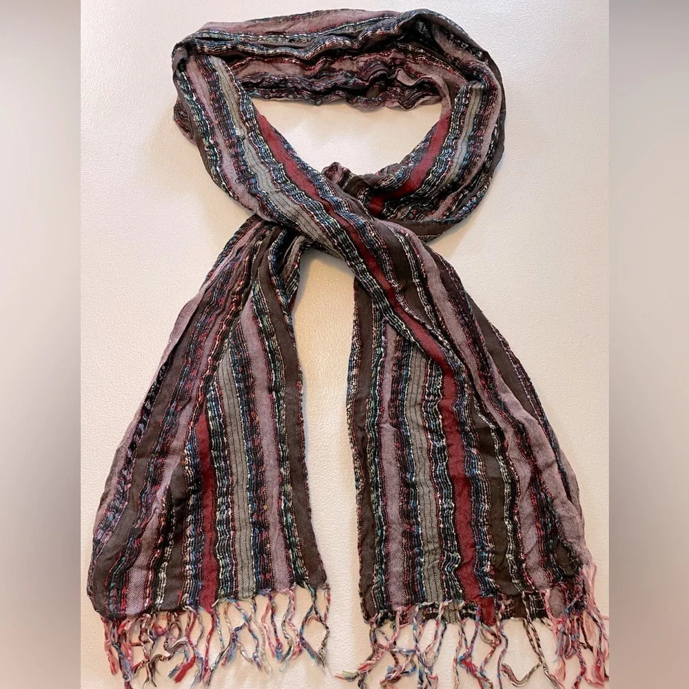 Maurice’s Infinitely scarf w/fringes measure 68’ long & is 💯% nylon multi color